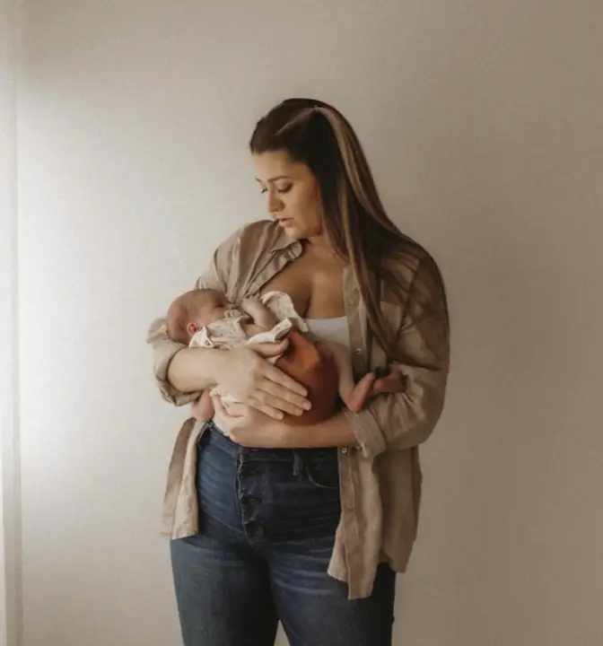 Newborn photographed in a soft home setting