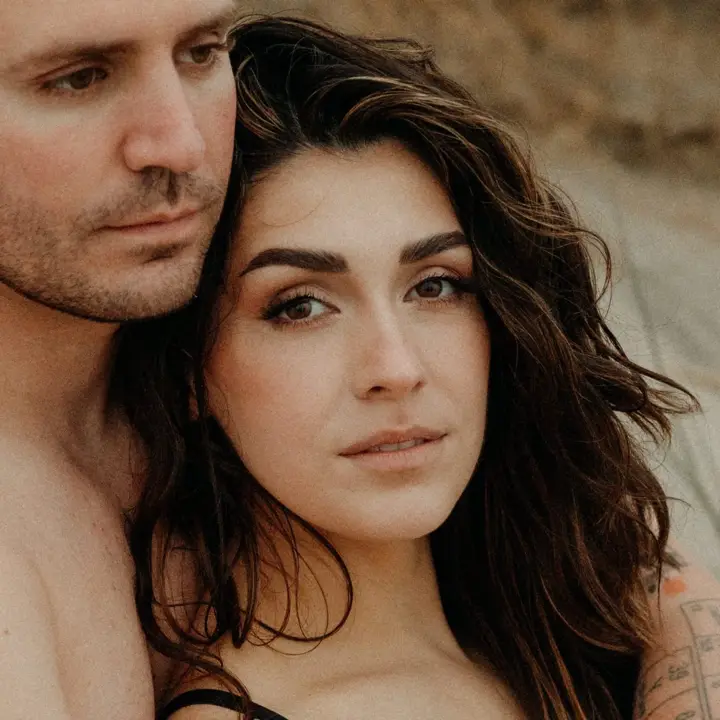 Couple close together in warm light